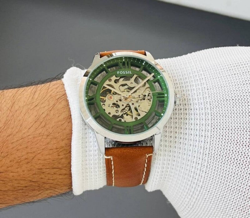 fossil townsman me3234 automatic watch with a green skeleton dial and brown leather strap