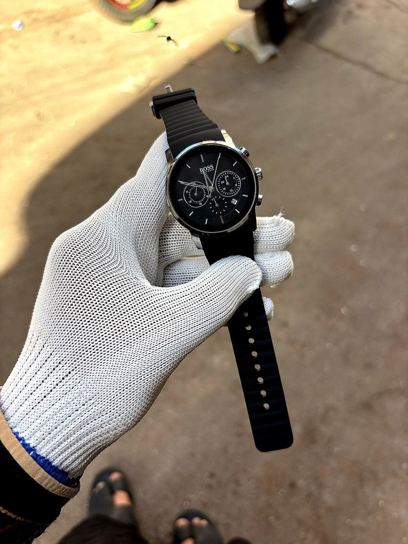 Hugo Boss black chronograph model featuring a black dial and a matching black silicone strap