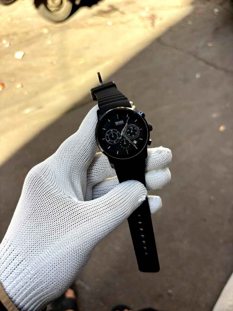 Hugo Boss full black chronograph model featuring a black dial and a matching black silicone strap