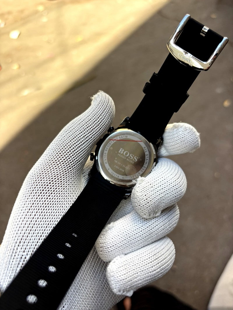 Hugo Boss full black chronograph model featuring a black dial and a matching black silicone strap